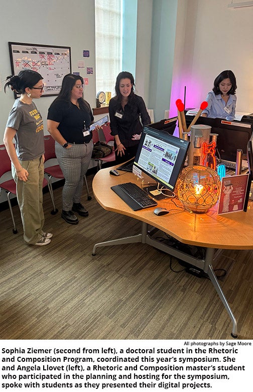Sophia Ziemer, doctoral student in the Rhetoric and Composition Program, with Angela Llovet, master’s student in Rhetoric and Composition, speaks with students at Digital Symposium.